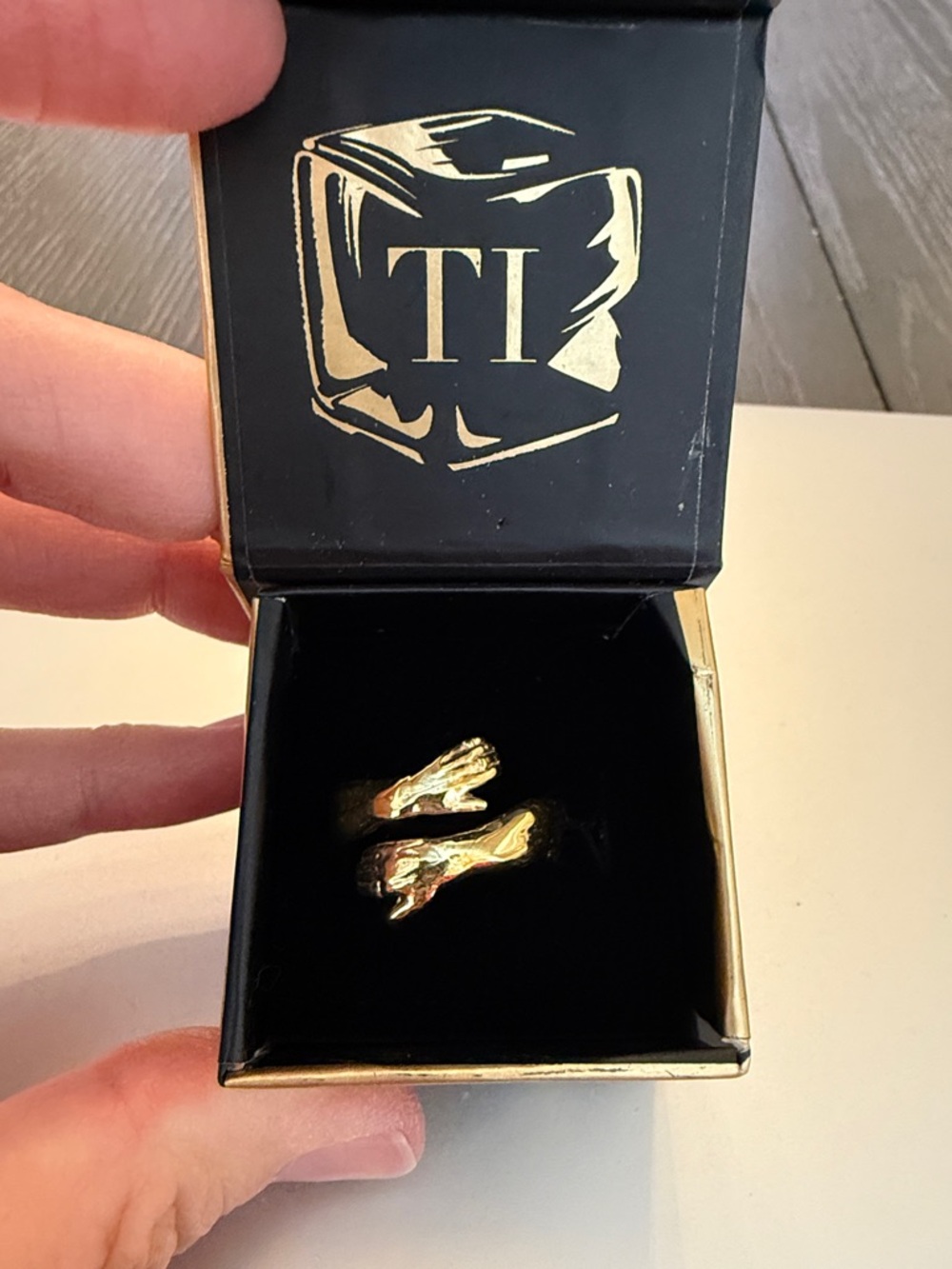 Tristen Ikaika Gold-Tone Hug Life Ring in Black Velvet Box
